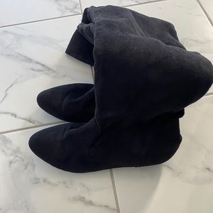 Tall black over the knee boots. Size 10. Great condition.